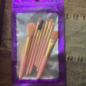 Pink travel sized makeup brushes